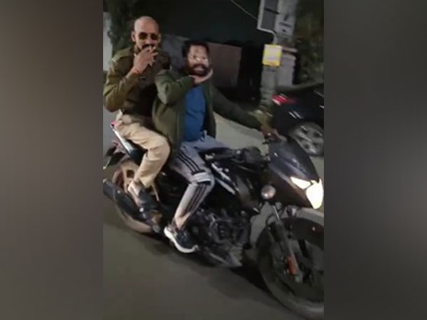 Madhya Pradesh Police constable just got the knock for doing this on a moving motorbike   