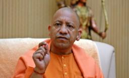 Take ‘batenge toh katenge’ message door to door: Adityanath